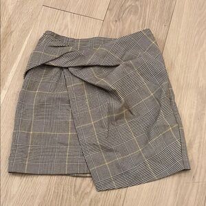 Babaton Mini Wrap Skirt with Asymmetrical Design Aritzia